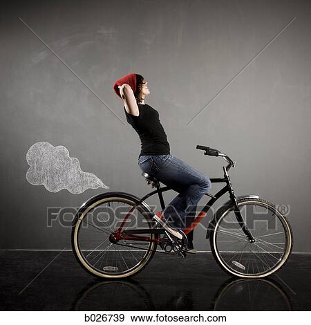 woman on a bicycle View Large Photo Image Stock Photo - woman on a bicycle. Fotosearch