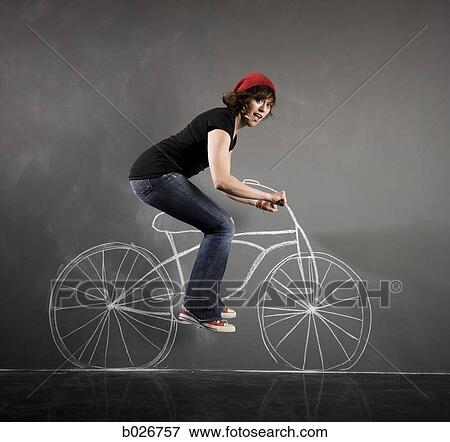 woman on a bicycle View Large Photo Image Stock Photo - woman on a bicycle. Fotosearch