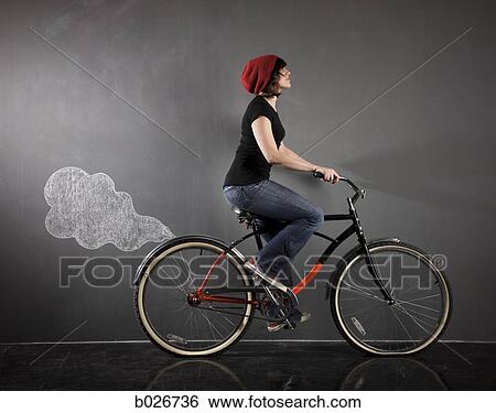 woman on a bicycle View Large Photo Image Stock Photograph - woman on a bicycle. Fotosearch