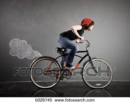 woman on a bicycle View Large Photo Image Stock Photography - woman on a bicycle. Fotosearch
