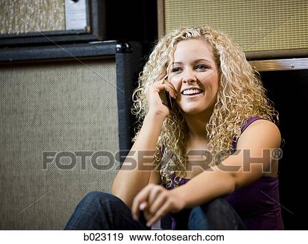 Stock Photo - woman on a cell phone. Fotosearch