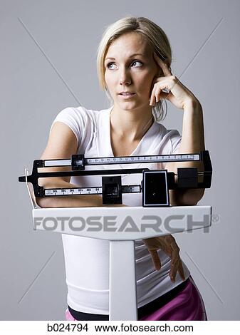 woman on a scale View Large Photo Image Picture - woman on a scale. Fotosearch