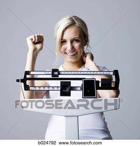 woman on a scale View Large Photo Image Stock Image - woman on a scale. Fotosearch