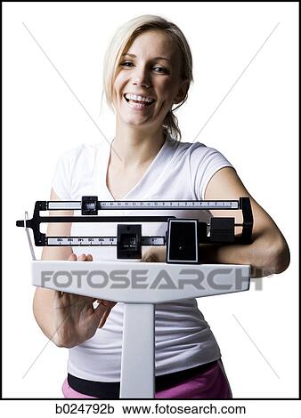woman on a scale View Large Photo Image Stock Image - woman on a scale. Fotosearch