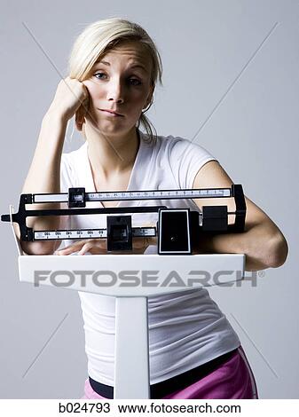 woman on a scale View Large Photo Image Stock Image - woman on a scale. Fotosearch