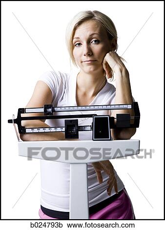 woman on a scale View Large Photo Image Stock Image - woman on a scale. Fotosearch