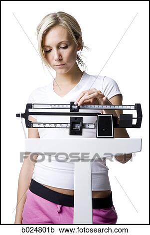 woman on a scale View Large Photo Image Stock Image - woman on a scale. Fotosearch