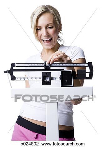 woman on a scale View Large Photo Image Stock Image - woman on a scale. Fotosearch