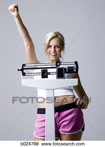 woman on a scale View Large Photo Image Stock Photo - woman on a scale. Fotosearch