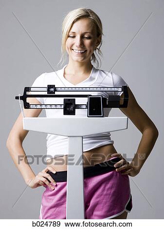 woman on a scale View Large Photo Image Stock Photo - woman on a scale. Fotosearch