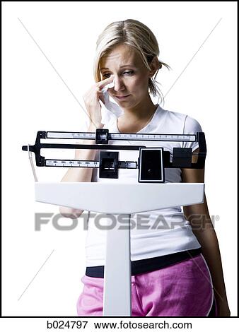 woman on a scale View Large Photo Image Stock Photo - woman on a scale. Fotosearch