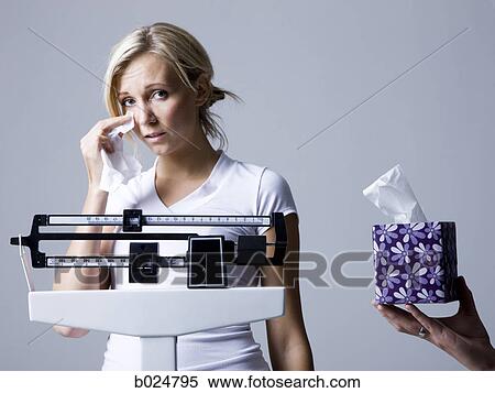 woman on a scale View Large Photo Image Stock Photography - woman on a scale. Fotosearch