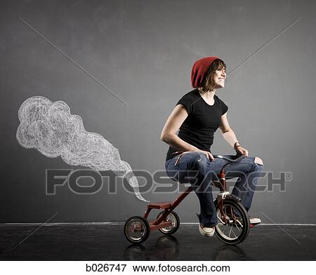 Stock Photo - woman on a tricycle. Fotosearch
