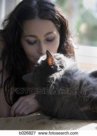 woman on a window bench with her cat View Large Photo Image Stock Photo - woman on a window bench with her cat. Fotosearch