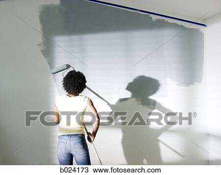 woman painting a room View Large Photo Image Stock Image - woman painting a room. Fotosearch