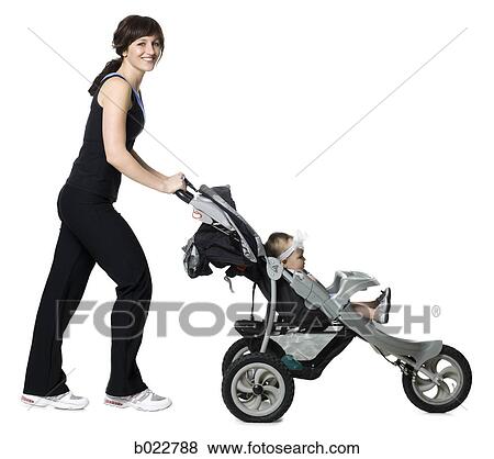 woman pushing her baby in a stroller View Large Photo Image Stock Photo - woman pushing her baby in a stroller. Fotosearch