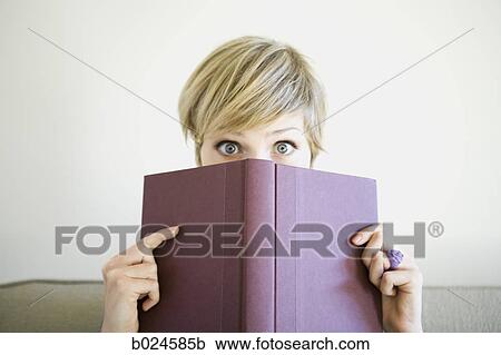 woman reading a book on the couch View Large Photo Image Stock Image - woman reading a book on the couch. Fotosearch