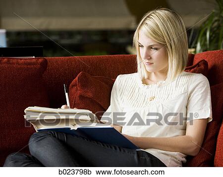 woman reading on the couch View Large Photo Image Stock Image - woman reading on the couch. Fotosearch