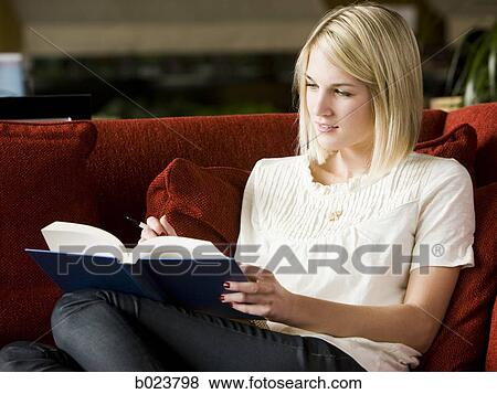 woman reading on the couch View Large Photo Image Stock Photo - woman reading on the couch. Fotosearch