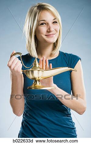 woman rubbing a magic lamp View Large Photo Image Stock Image - woman rubbing a magic lamp. Fotosearch