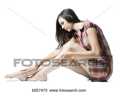 woman rubbing her legs View Large Photo Image Stock Image - woman rubbing her legs. Fotosearch