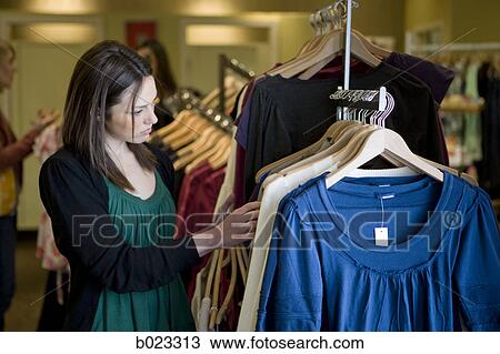 woman shopping for clothes View Large Photo Image Stock Image - woman shopping for clothes. Fotosearch