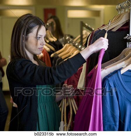 woman shopping for clothes View Large Photo Image Stock Image - woman shopping for clothes. Fotosearch
