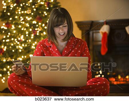 woman shopping online at christmas View Large Photo Image Stock Photo - woman shopping online at christmas. Fotosearch