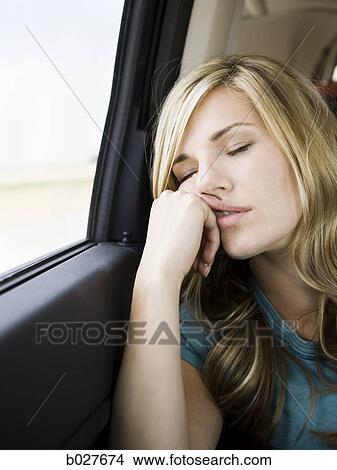 woman sleeping in the car View Large Photo Image Picture - woman sleeping in the car. Fotosearch