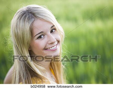 woman standing in a field View Large Photo Image Stock Photo - woman standing in a field. Fotosearch