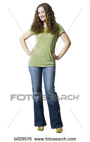 Stock Photograph - woman standing with her hands on her hips. Fotosearch