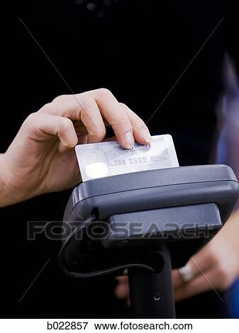 woman swiping a credit card View Large Photo Image Stock Photo - woman swiping a credit card. Fotosearch
