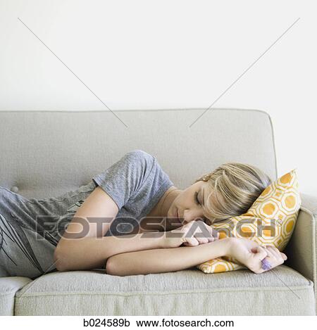 woman taking a nap on the couch View Large Photo Image Stock Image - woman taking a nap on the couch. Fotosearch