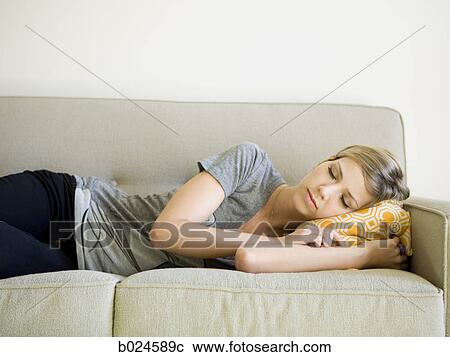 woman taking a nap on the couch View Large Photo Image Stock Image - woman taking a nap on the couch. Fotosearch