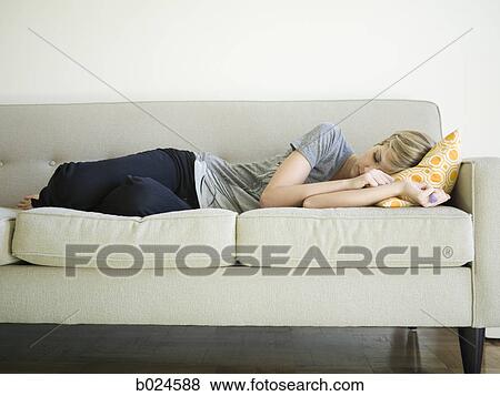 woman taking a nap on the couch View Large Photo Image Stock Photo - woman taking a nap on the couch. Fotosearch