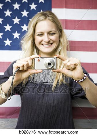 woman taking a picture with a digital camera View Large Photo Image Stock Photograph - woman taking a picture with a digital camera. Fotosearch