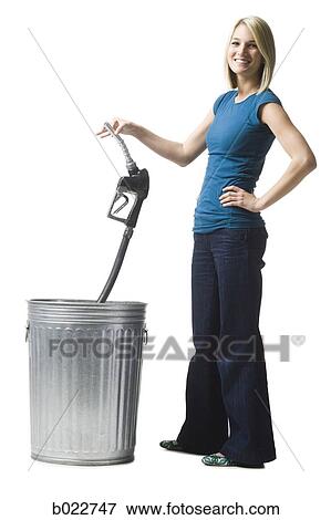 woman throwing a gas pump nozzle in the trash View Large Photo Image Stock Photo - woman throwing a gas pump nozzle in the trash. Fotosearch