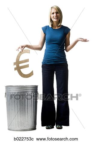 Stock Image - woman throwing euro symbol in the trash. Fotosearch