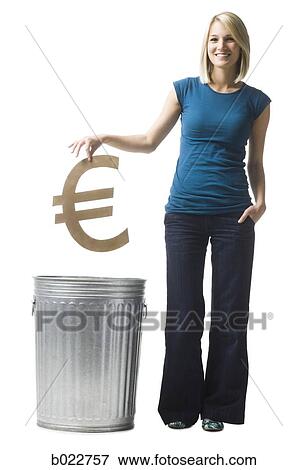 woman throwing euro symbol in the trash View Large Photo Image Stock Photo - woman throwing euro symbol in the trash. Fotosearch