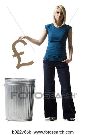 woman throwing pound symbol in the trash View Large Photo Image Stock Image - woman throwing pound symbol in the trash. Fotosearch