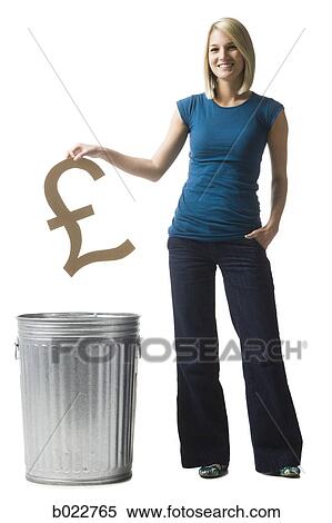 woman throwing pound symbol in the trash View Large Photo Image Stock Photography - woman throwing pound symbol in the trash. Fotosearch