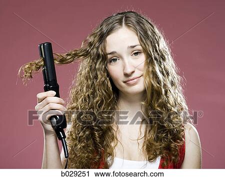 woman trying to straighten her hair View Large Photo Image Stock Image - woman trying to straighten her hair. Fotosearch