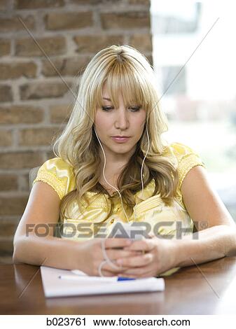 woman using her cell phone during a meeting View Large Photo Image Stock Image - woman using her cell phone during a meeting. Fotosearch