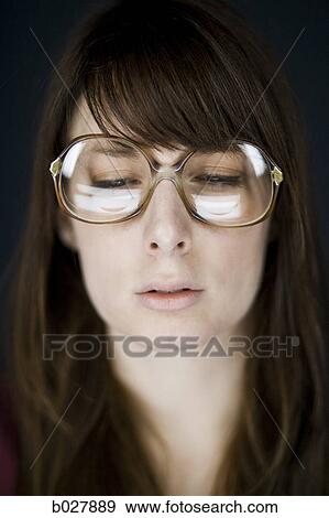 woman wearing vintage glasses View Large Photo Image Stock Photo - woman wearing vintage glasses. Fotosearch