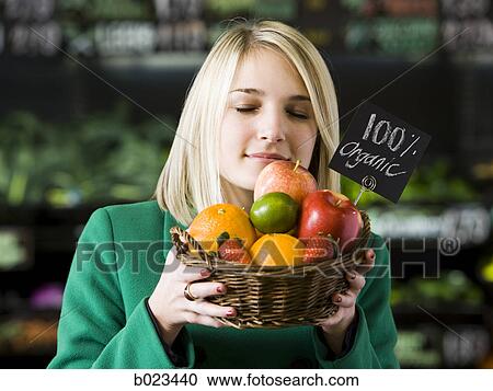 woman with a basket of organic fruit View Large Photo Image Stock Image - woman with a basket of organic fruit. Fotosearch