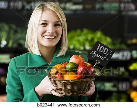 woman with a basket of organic fruit View Large Photo Image Stock Image - woman with a basket of organic fruit. Fotosearch