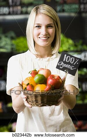 woman with a basket of organic fruit View Large Photo Image Stock Image - woman with a basket of organic fruit. Fotosearch