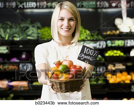 woman with a basket of organic fruit View Large Photo Image Stock Image - woman with a basket of organic fruit. Fotosearch