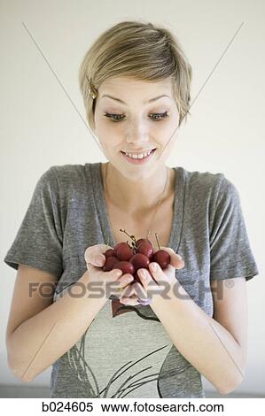 woman with a handful of cherries View Large Photo Image Stock Photography - woman with a handful of cherries. Fotosearch