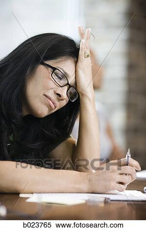 woman with a headache at work View Large Photo Image Stock Photography - woman with a headache at work. Fotosearch
